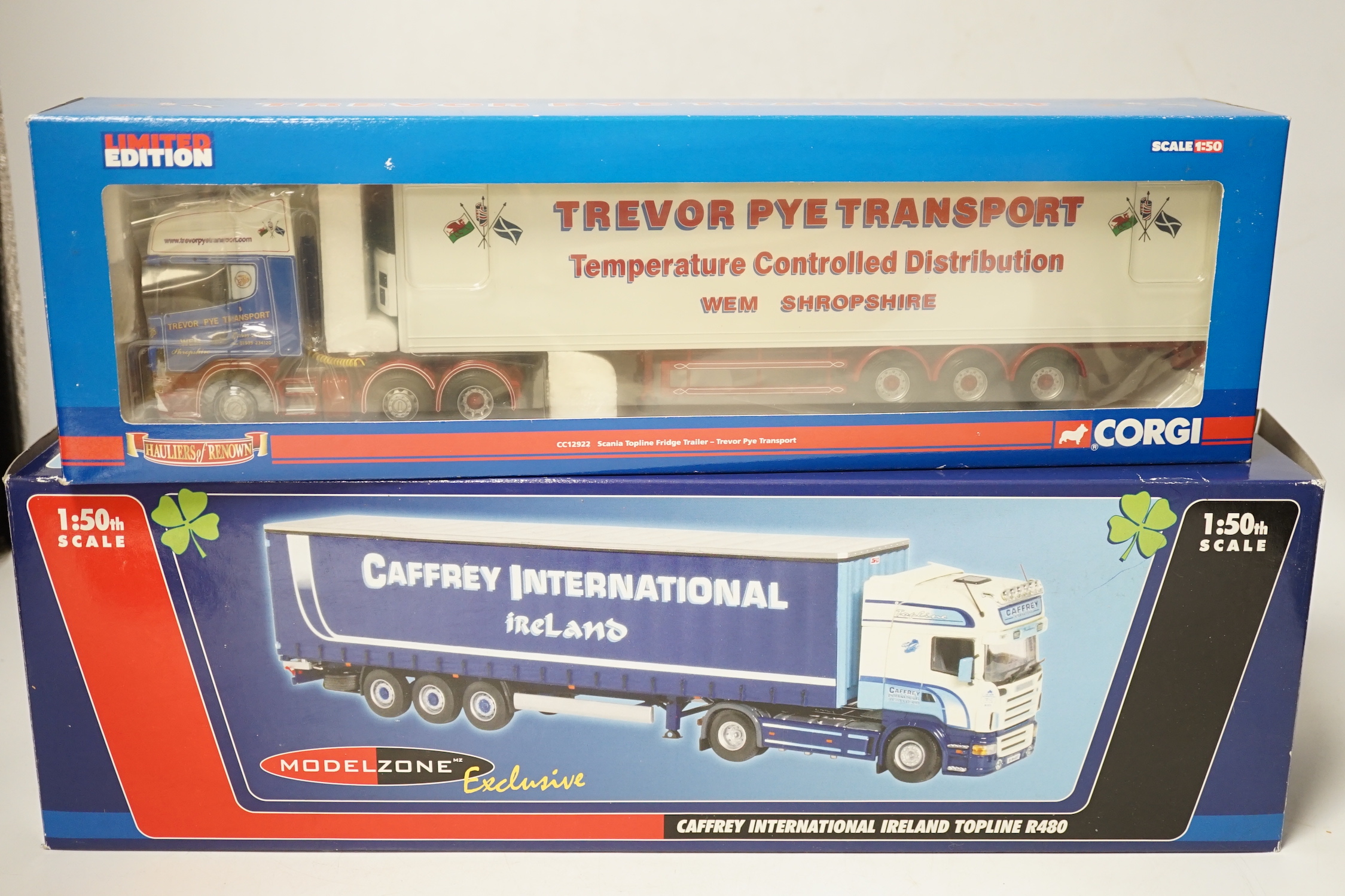 Four boxed Corgi and Universal Hobbies 1:50 scale articulated trucks; a Scania refrigerated lorry (CC13727), Scania Topline refrigerated lorry (CC12922), a Renault Premium Curtainside (75602), and another Scania Topline
